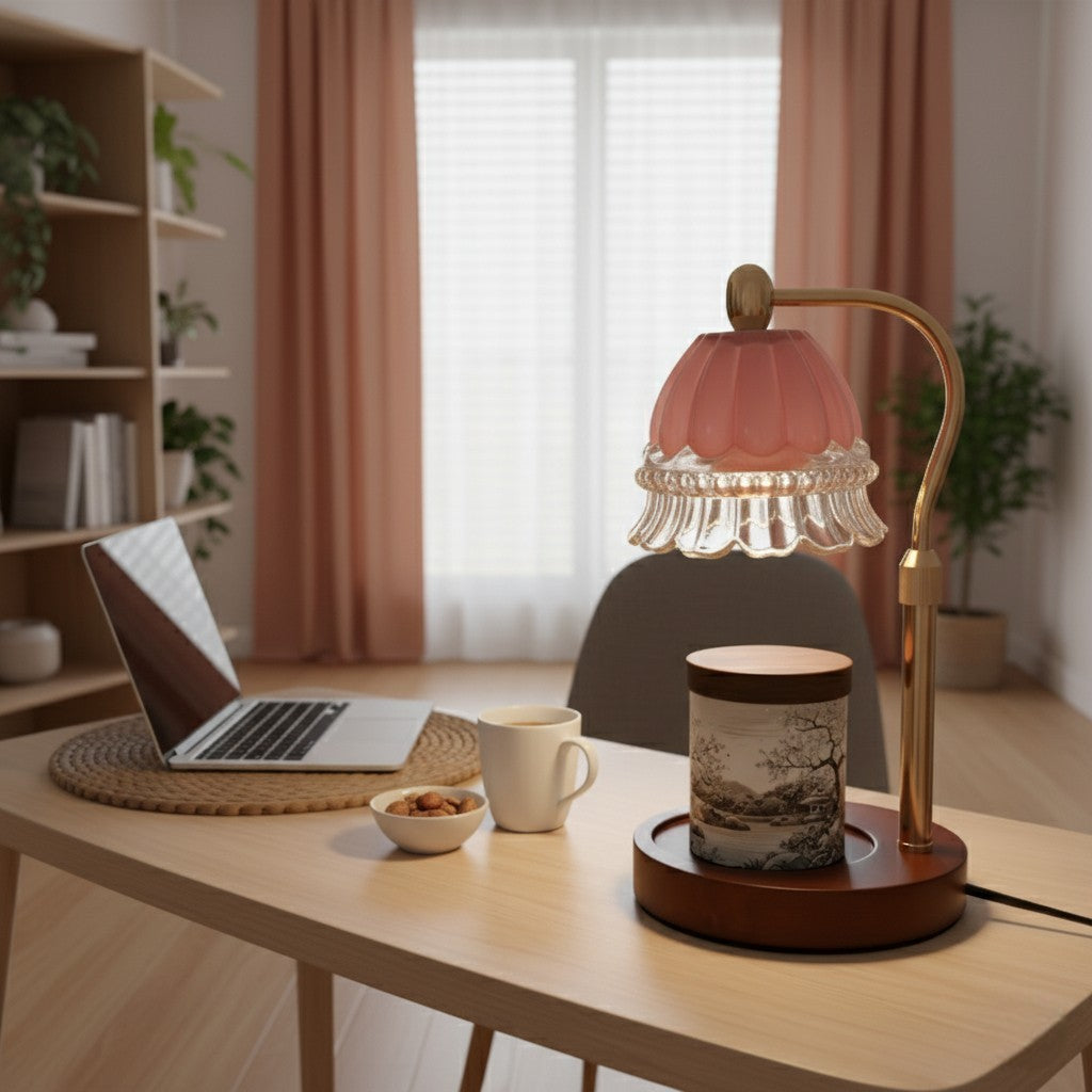 Home office desk with laptop, lamp, and decor items in a cozy room.