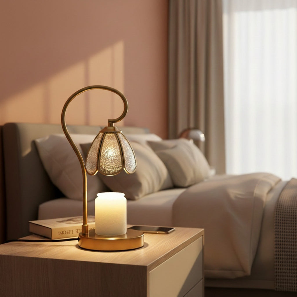 Decorative lamp with a candle on a nightstand in a bedroom setting