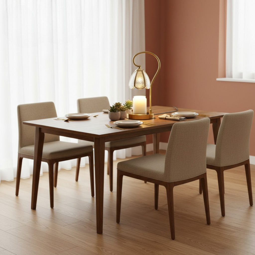 Dining room with wooden table and chairs, lamp, and candles on a wooden floor.