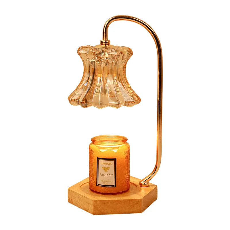 Decorative lamp with amber glass shade and candle on a white background