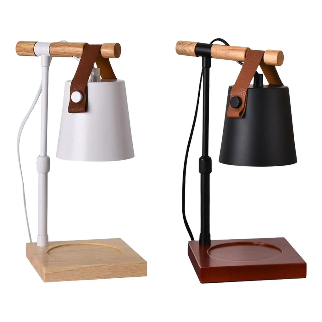 Two table lamps with wooden stands and leather straps on a white background