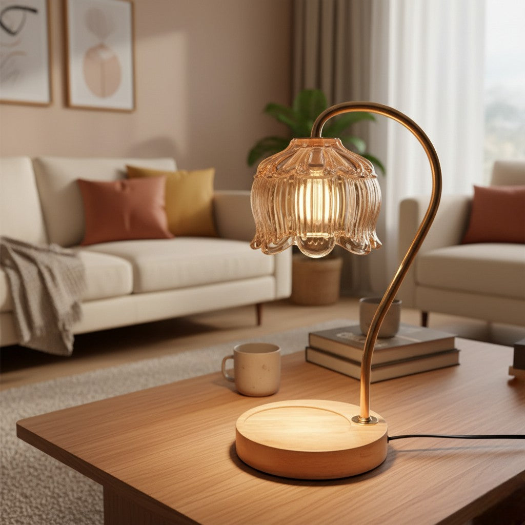 Decorative table lamp on a wooden coffee table in a living room setting.