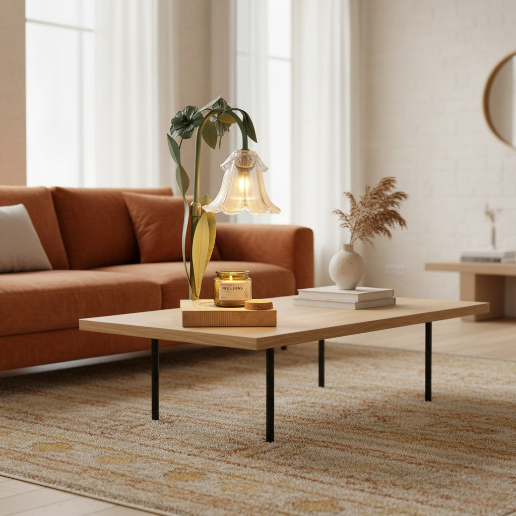 Modern living room with a brown sofa, coffee table, and decorative items.